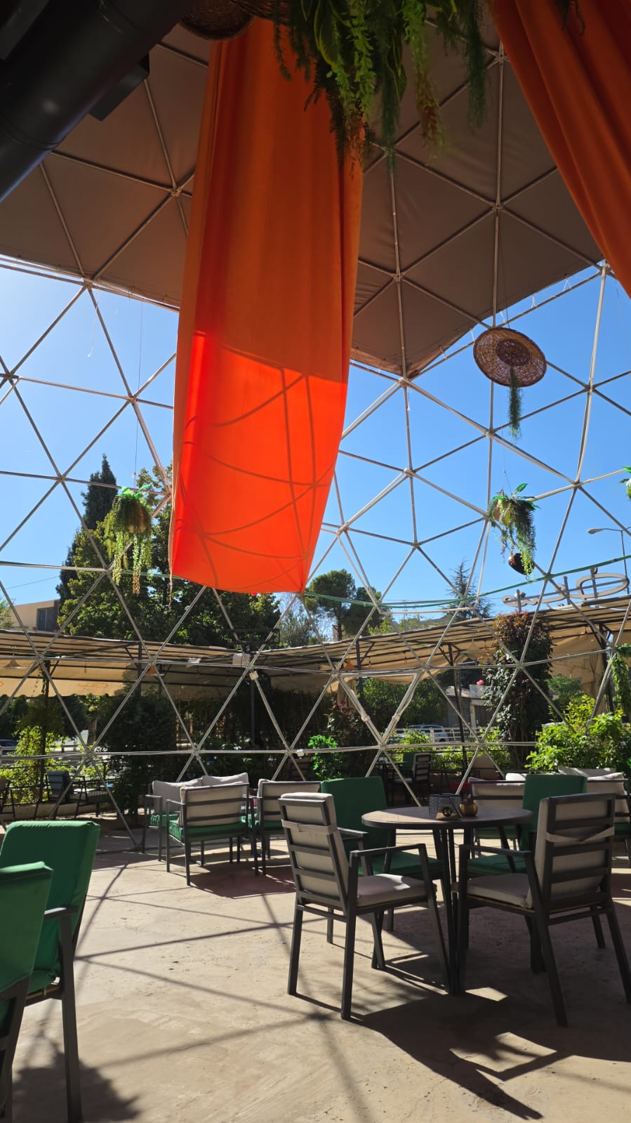 Sunlit seating beneath the Saif Cafe dome