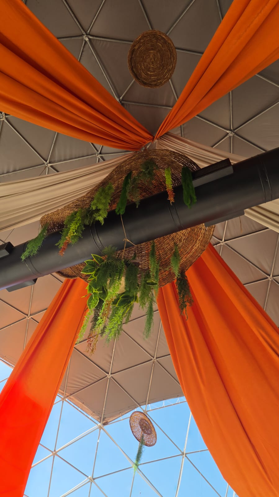 Orange drapery and woven details in the café